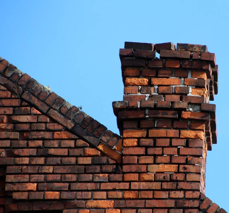Signs Your Westchester Home Needs a Chimney Inspection Damaged chimney on an Westchester home showing cracks and missing mortar